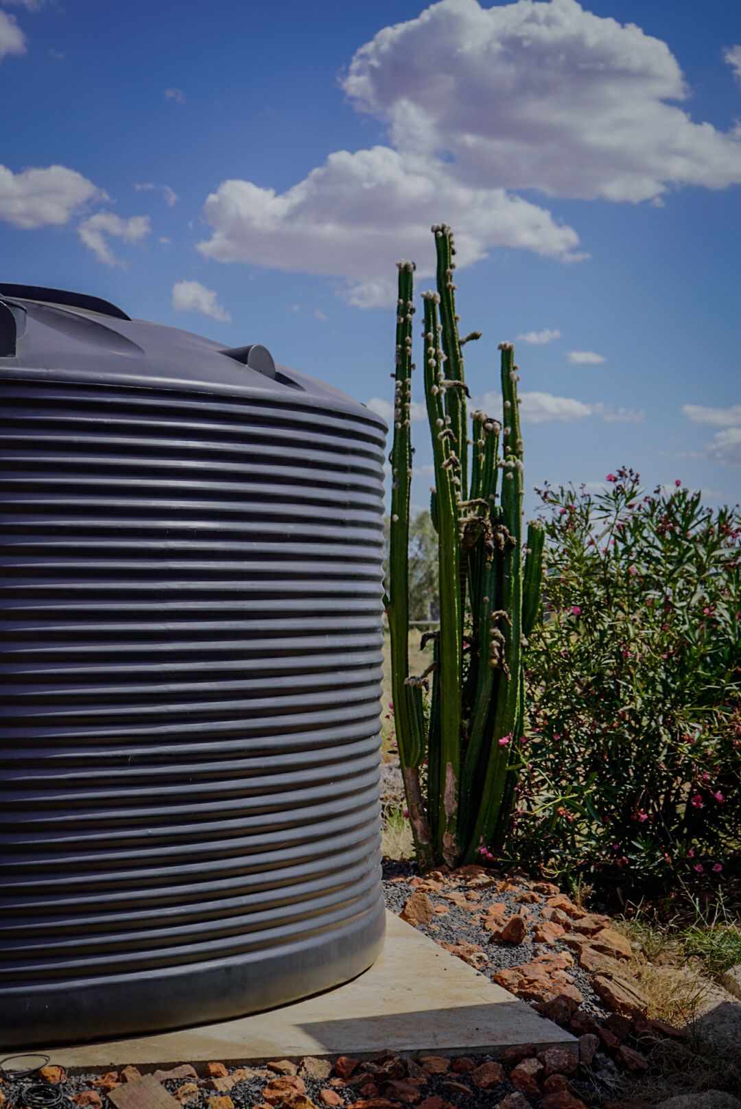 22,500ltr Round Poly Water Tank in Monument Colour Installed on a Concrete Slab